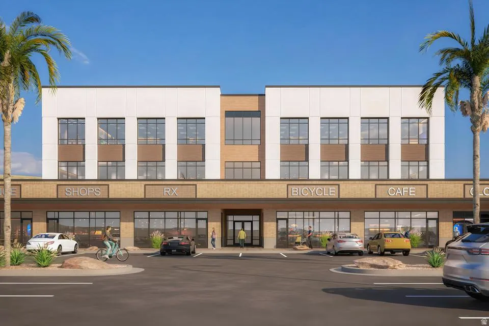 View of property with uncovered parking