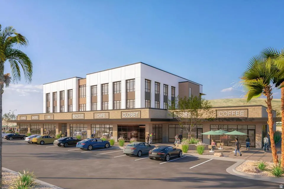 View of commercial property featuring uncovered parking