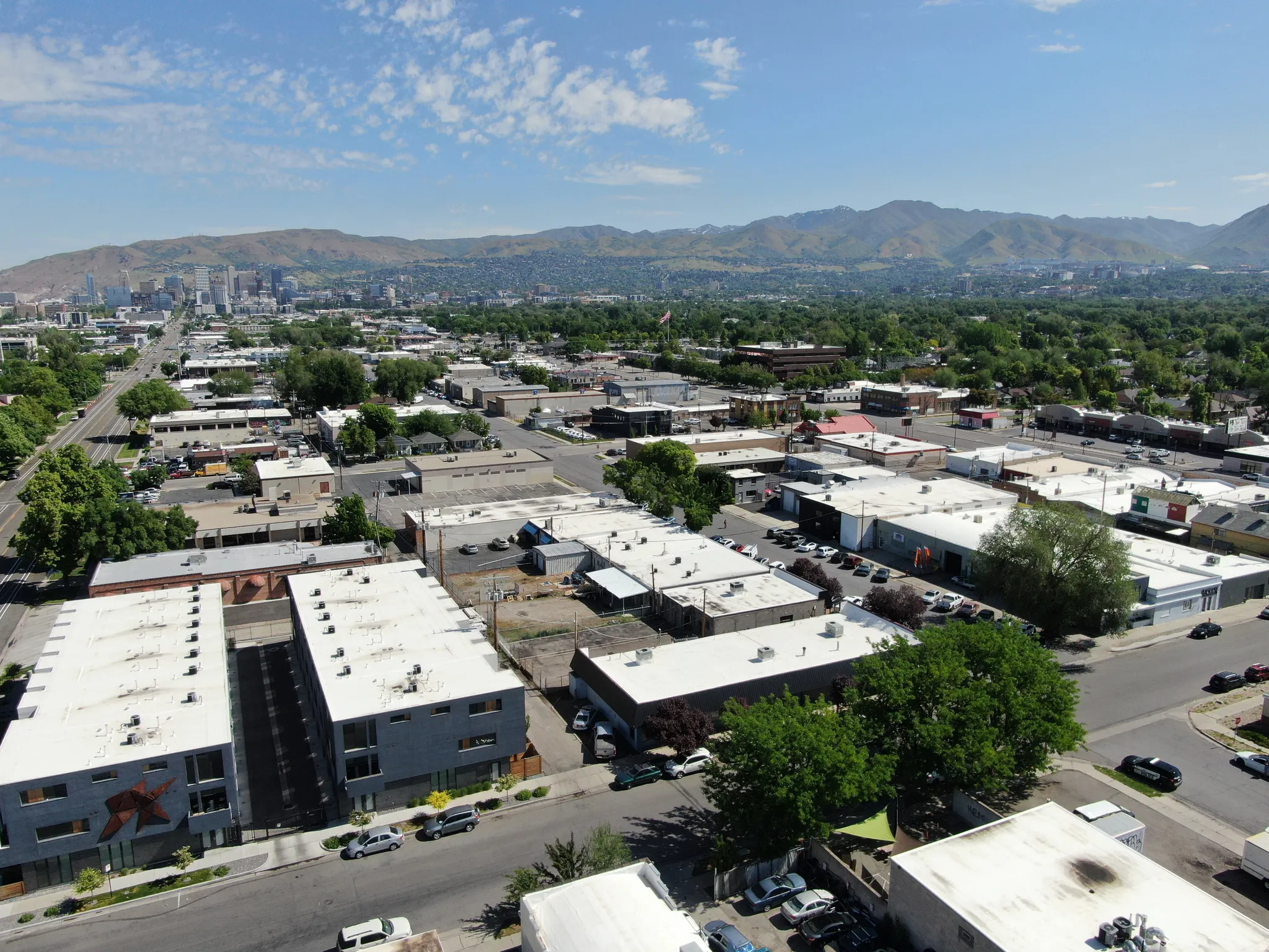 Aerial overview of property's location featuring a mountain backdrop