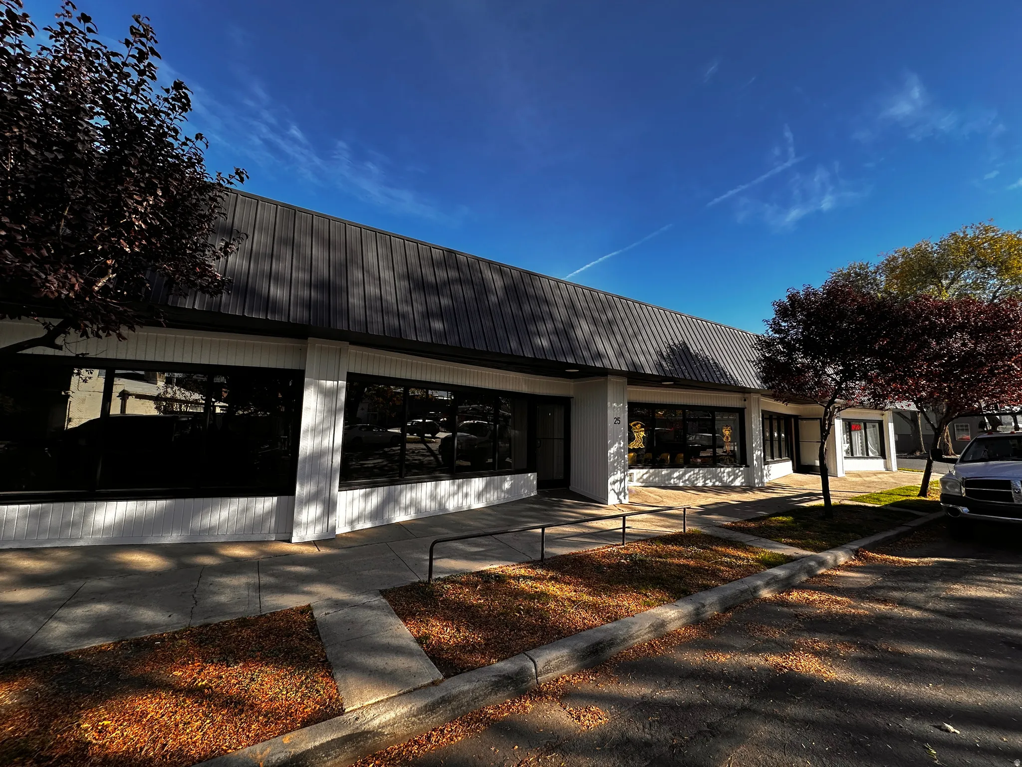 View of front of house with a metal roof