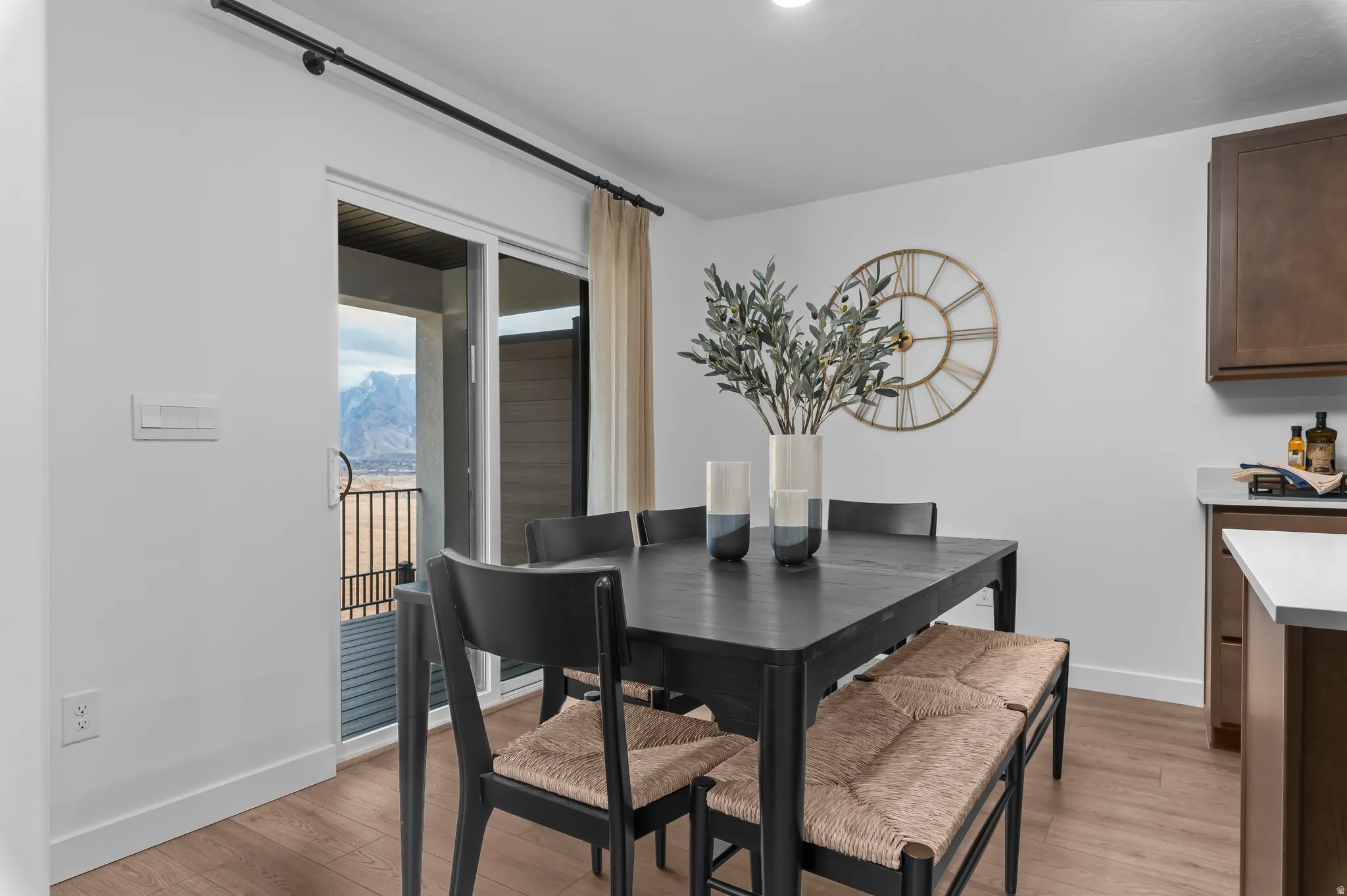Dining space with light wood-style flooring and a mountain view