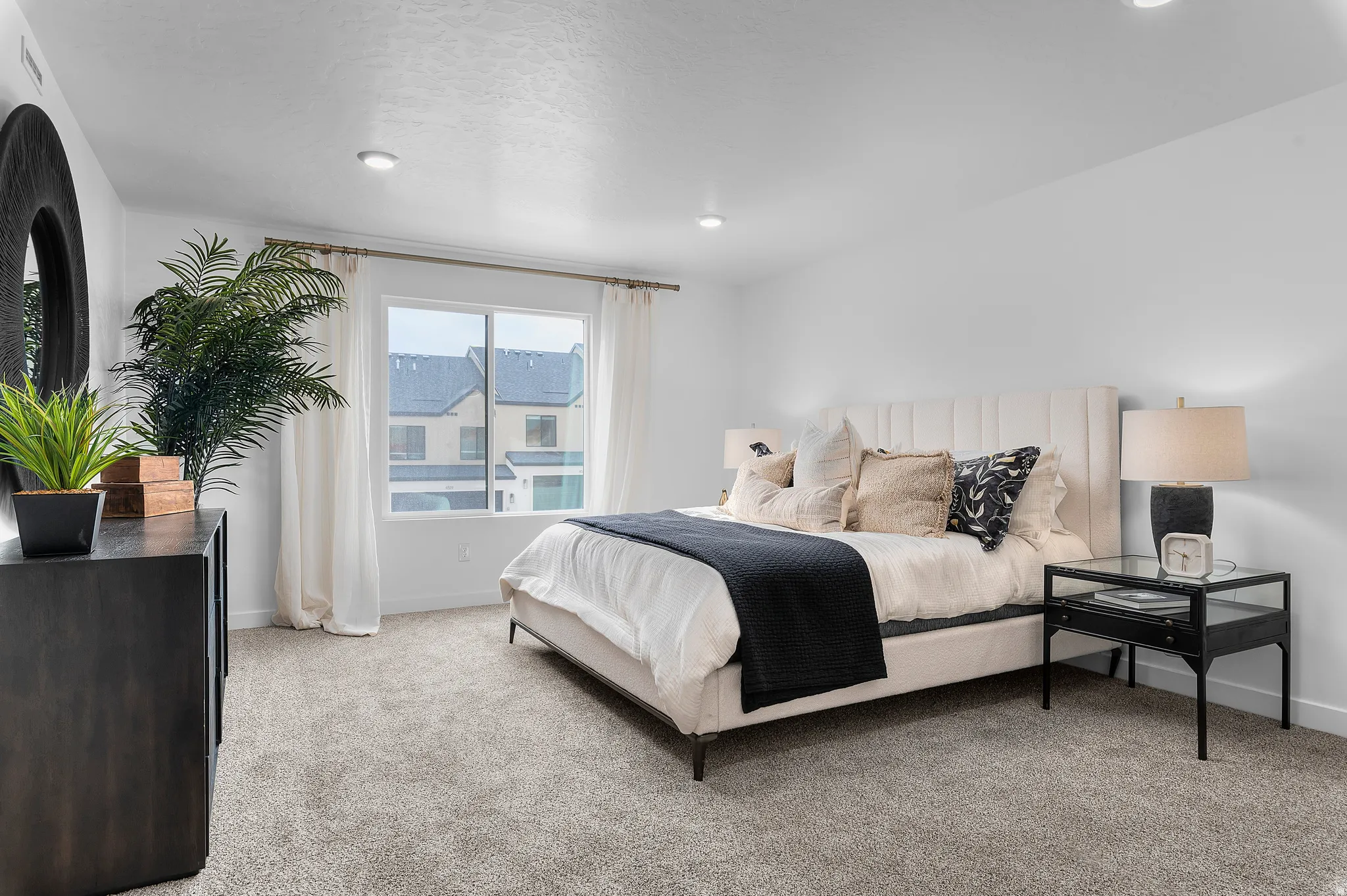 Bedroom with light carpet and baseboards