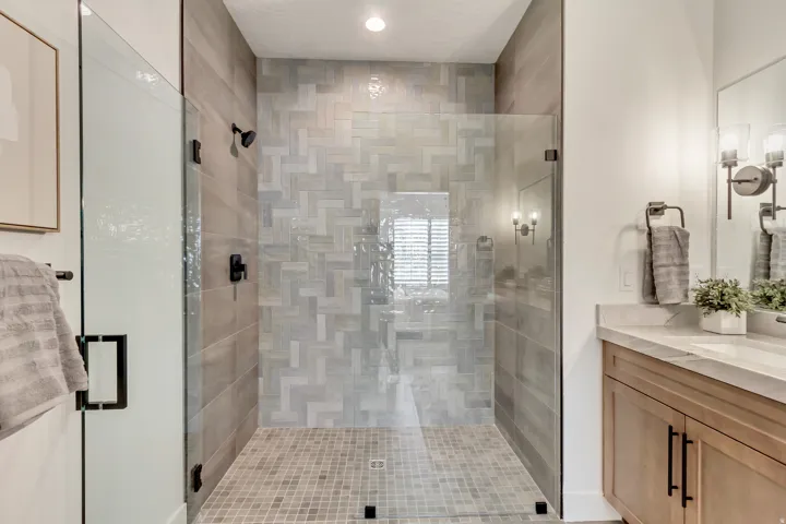 Bathroom featuring vanity and a shower stall
