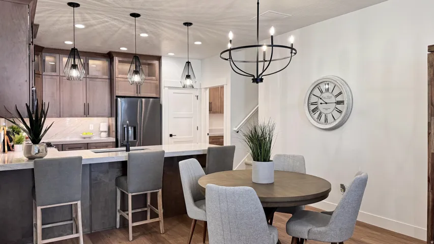 Dining area featuring dark wood-type flooring and a chandelier