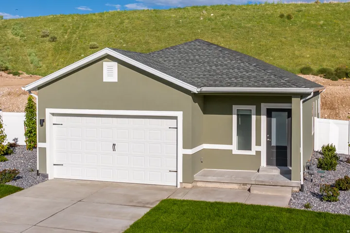 View of front of property with stucco siding, an attached garage, concrete driveway, roof with shingles, and a porch