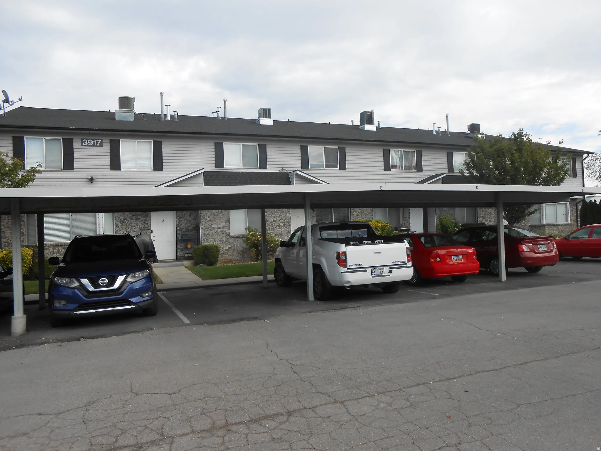 View of front of property with covered parking