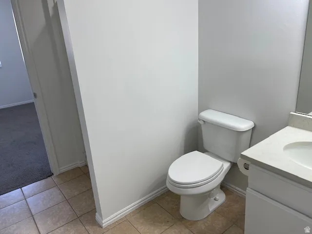 Bathroom with vanity and light tile patterned flooring