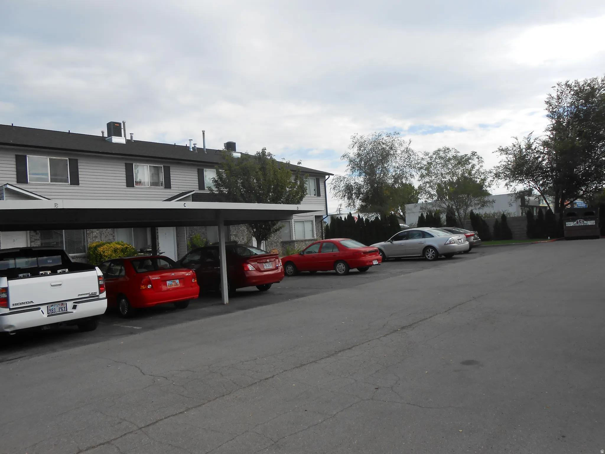 Covered parking lot with a residential view