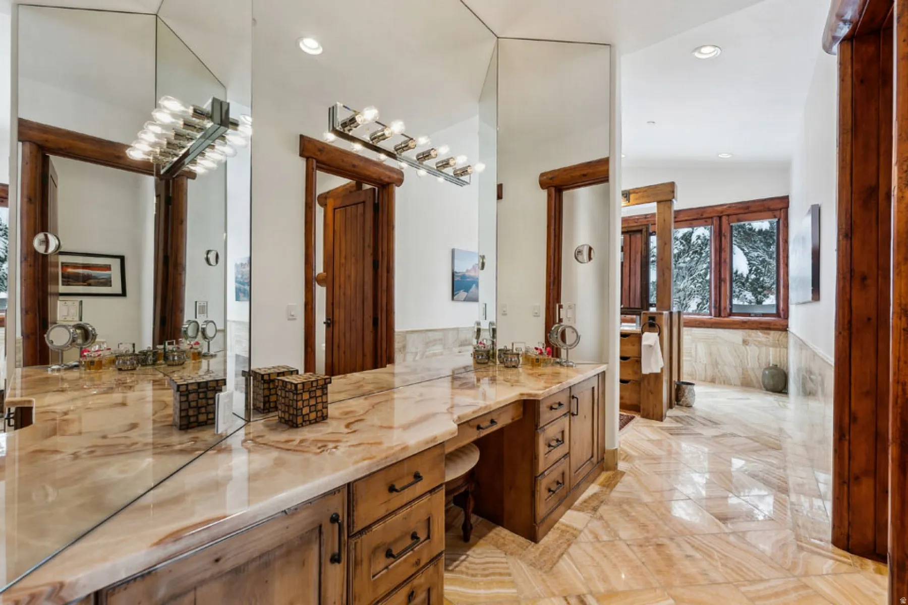 Bathroom featuring recessed lighting, vanity, and vaulted ceiling