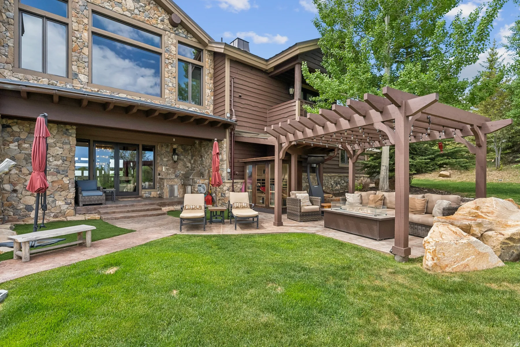 View of home's community featuring a patio area, a pergola, and outdoor lounge area