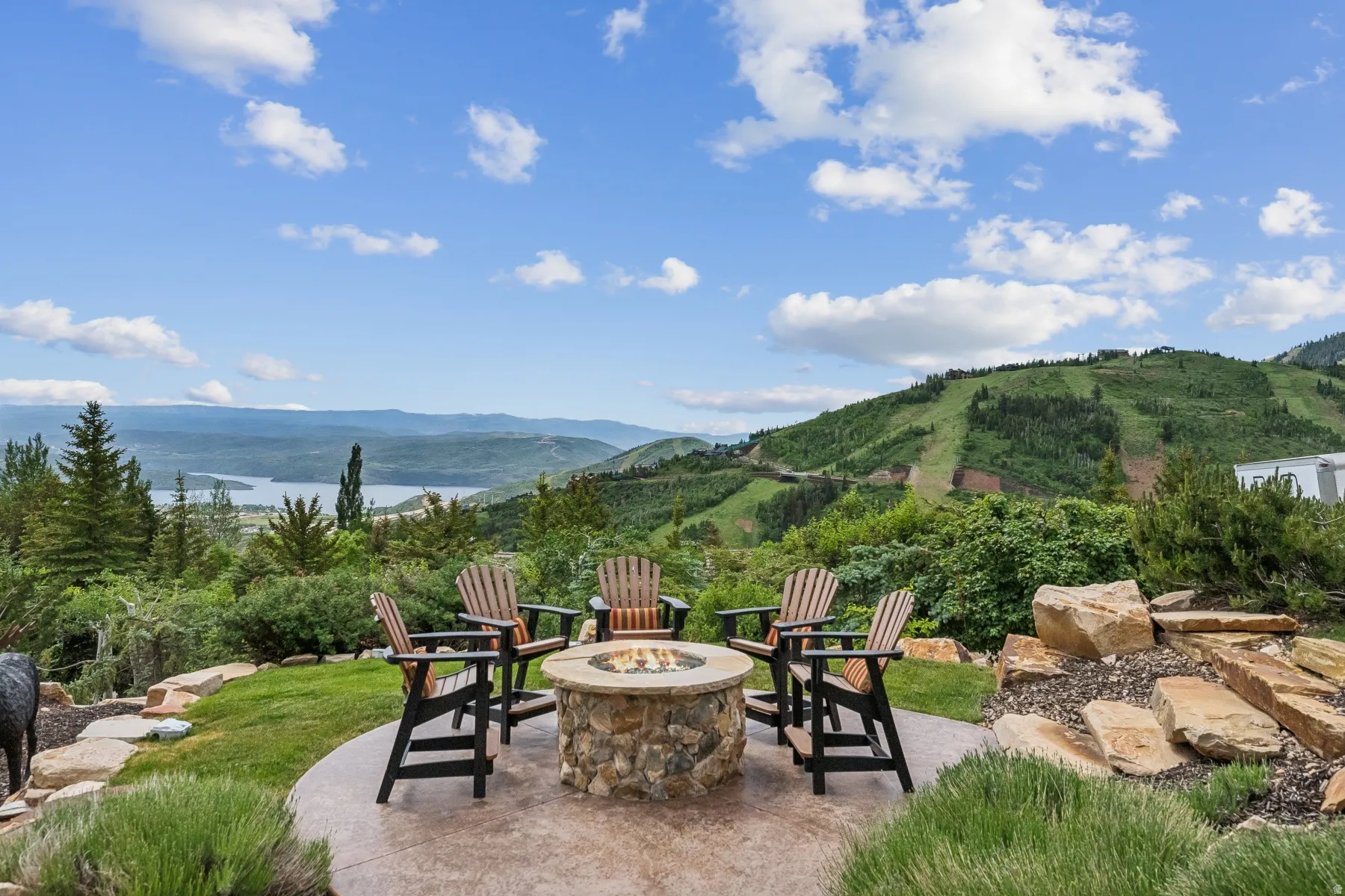 View of patio / terrace with a mountain view and a fire pit