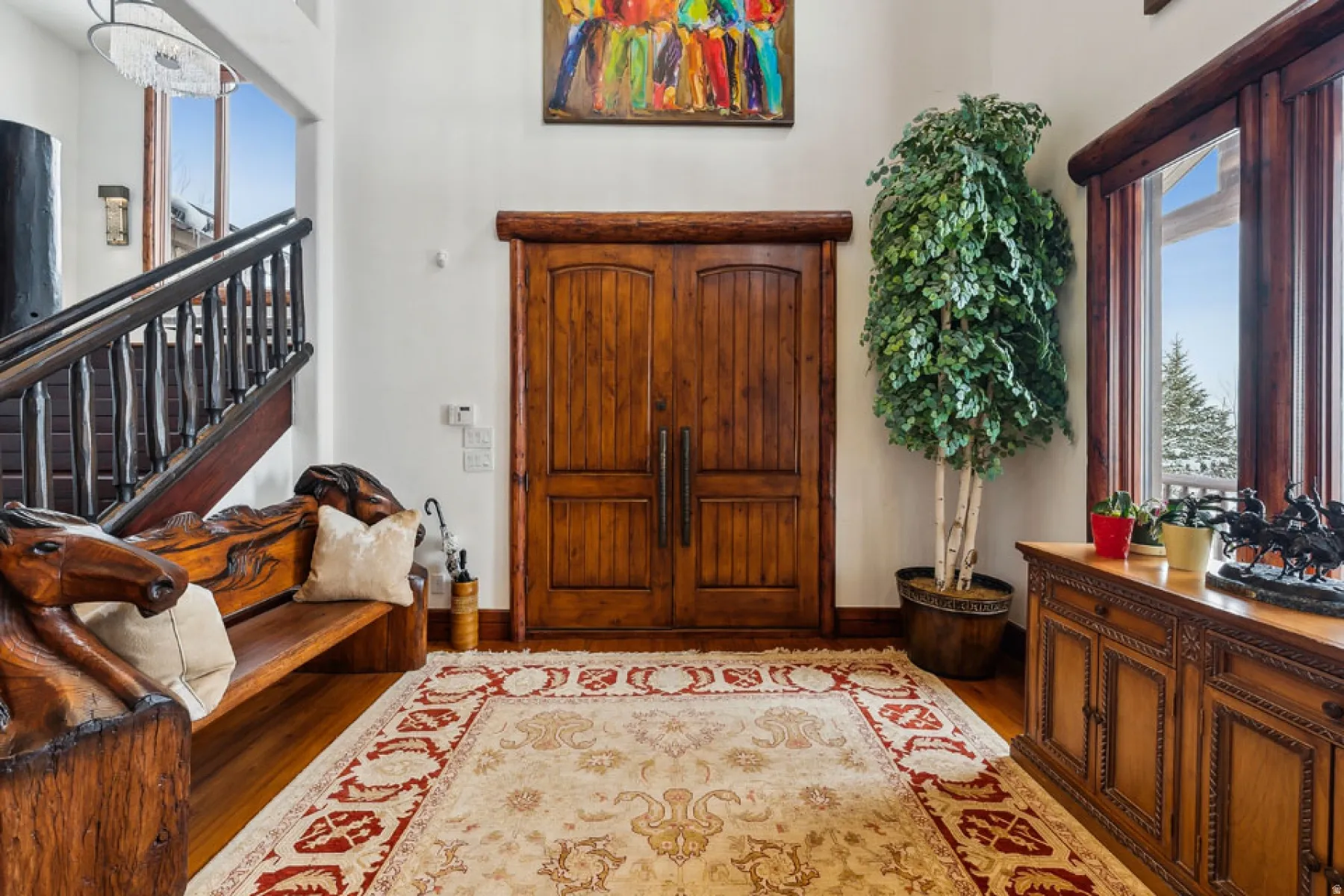 Entrance foyer with stairs and light wood finished floors