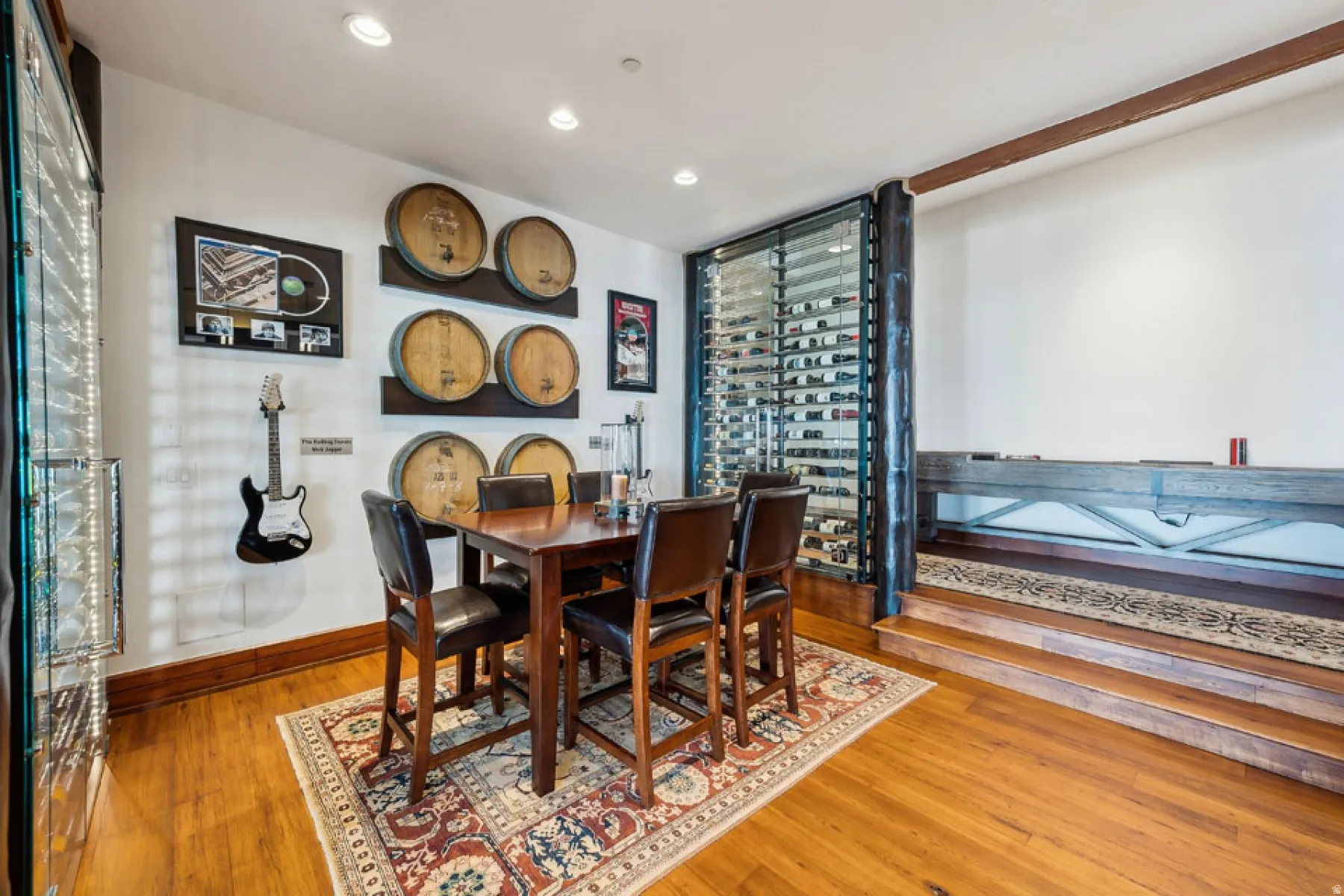 Dining space featuring wood-type flooring and recessed lighting