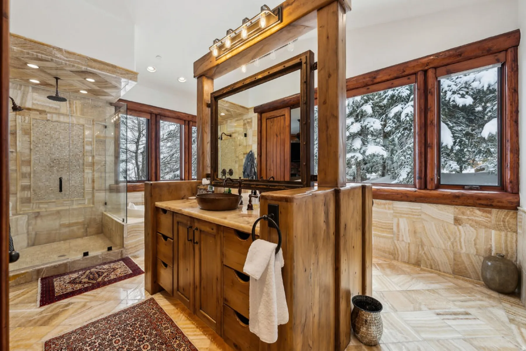 Bathroom featuring vanity, a shower stall, and a bath