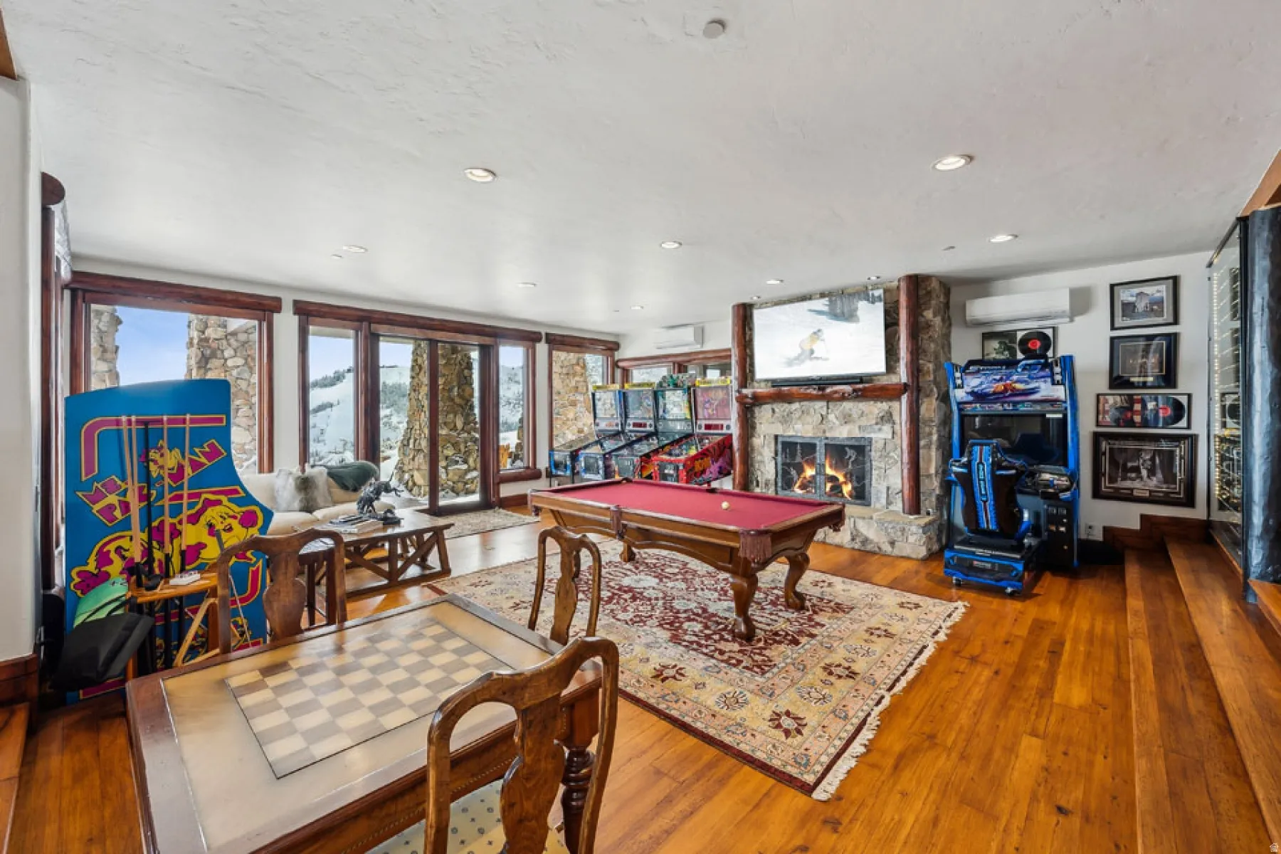 Rec room featuring billiards table, hardwood / wood-style flooring, a fireplace, and recessed lighting