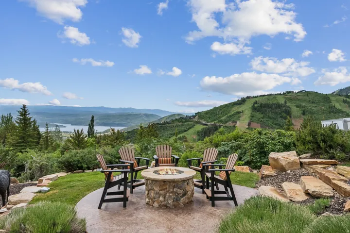 View of patio / terrace with a mountain view and a fire pit