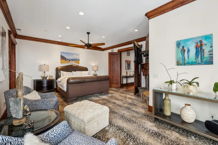 Bedroom with crown molding and recessed lighting