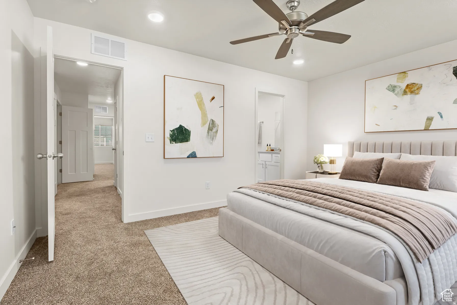 Bedroom with light carpet, connected bathroom, a ceiling fan, and recessed lighting