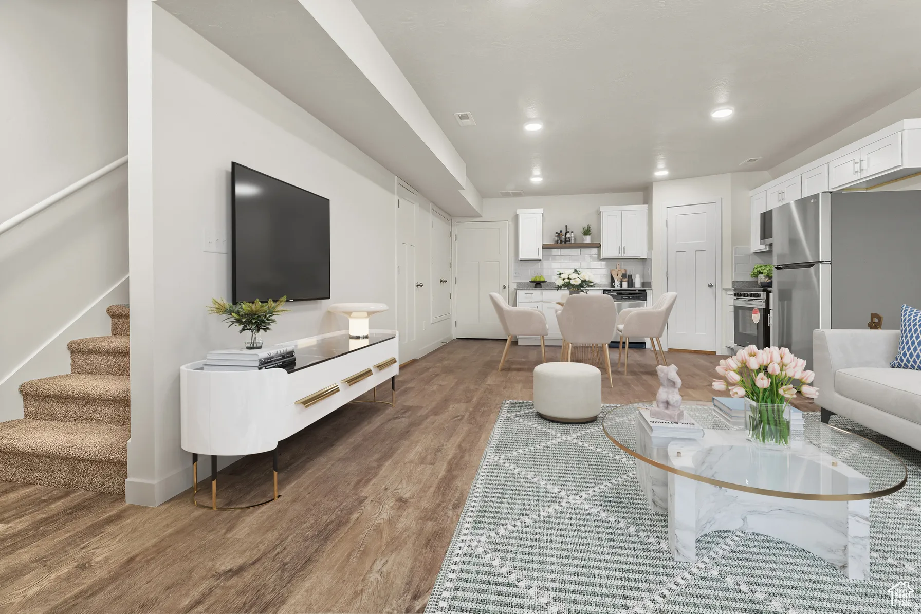 Living area featuring dark wood-style floors and recessed lighting