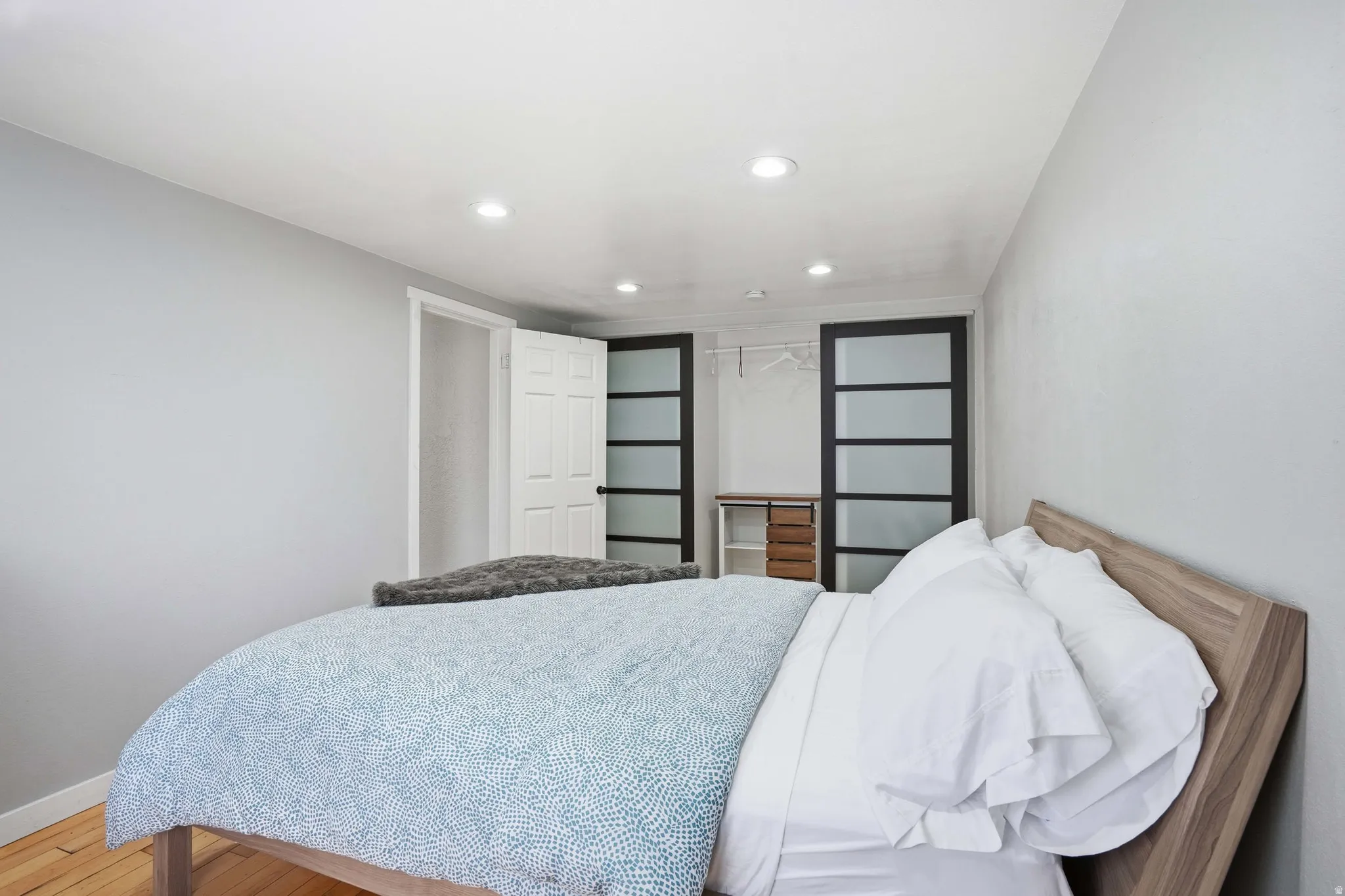 Bedroom featuring recessed lighting and wood finished floors