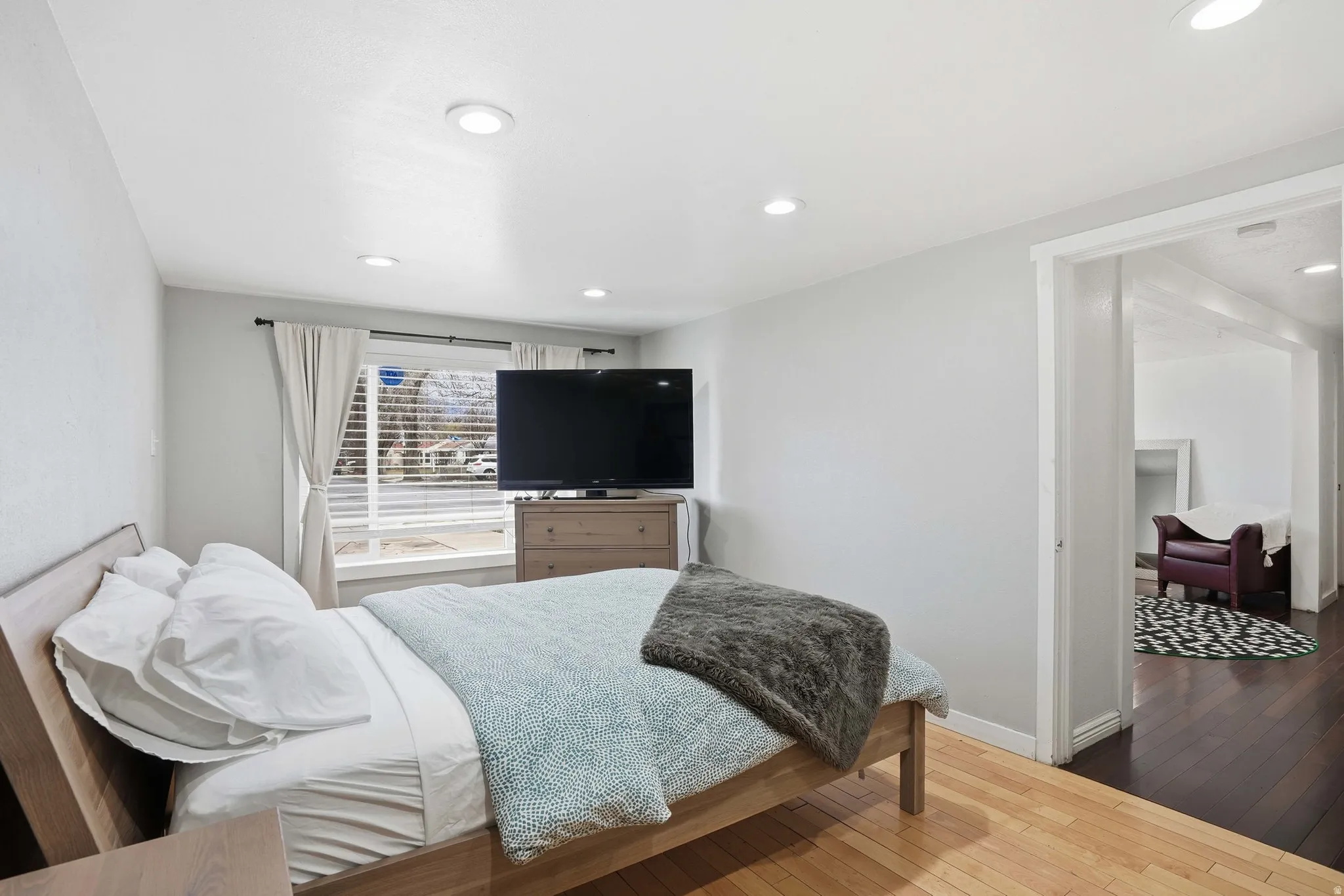 Bedroom featuring hardwood / wood-style flooring and recessed lighting