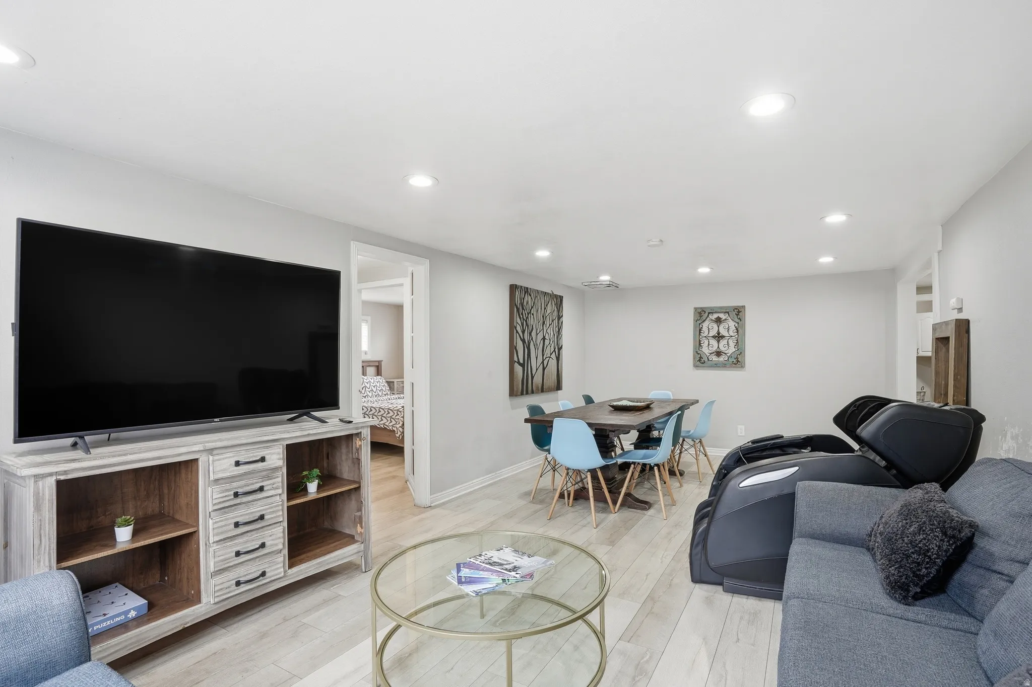 Living room with recessed lighting and light wood-style flooring