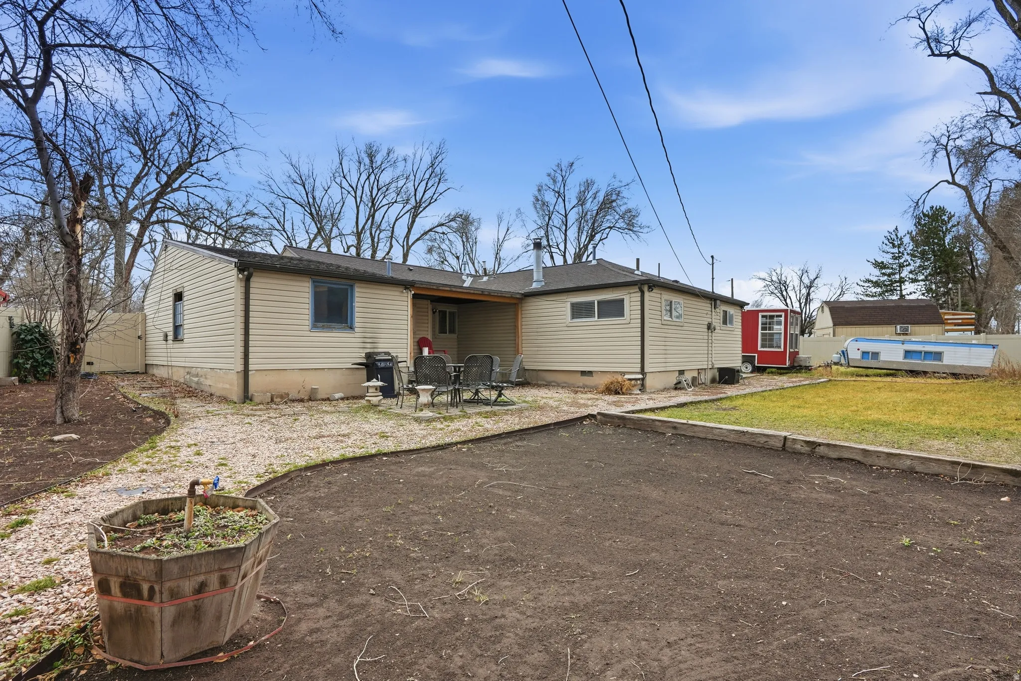 Back of house featuring a patio and a yard