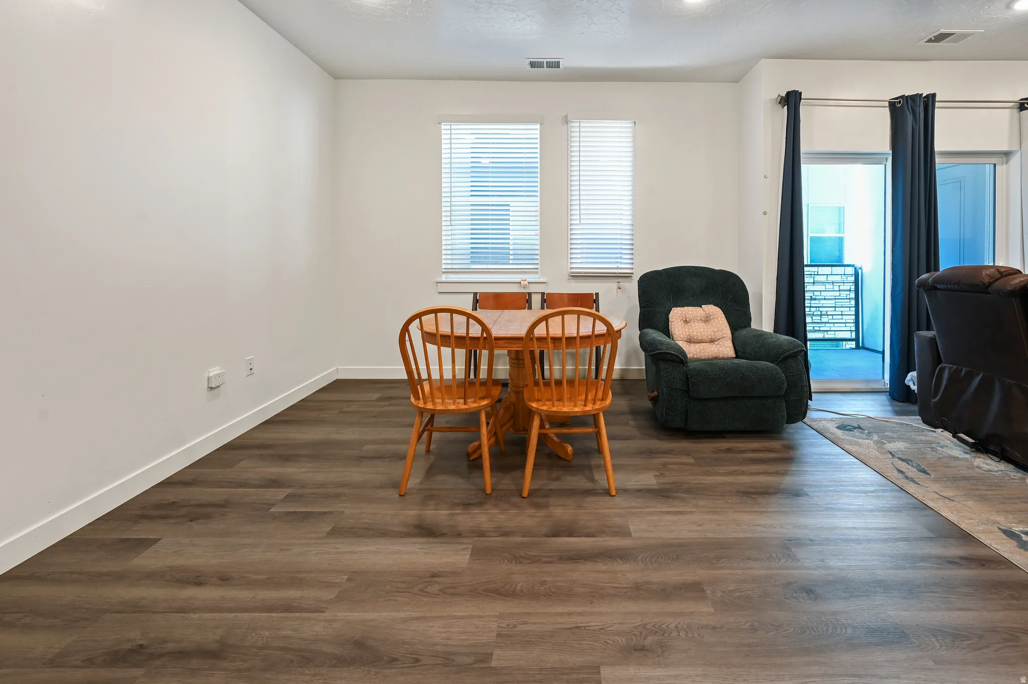 Dining room featuring dark wood-type flooring