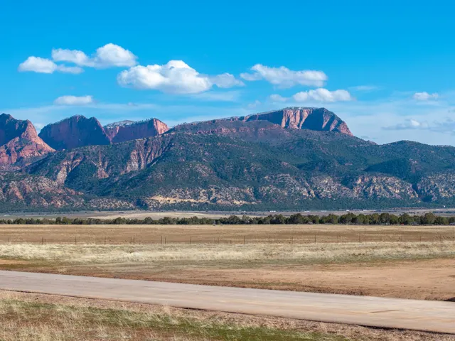 View of mountain background featuring rural landscape