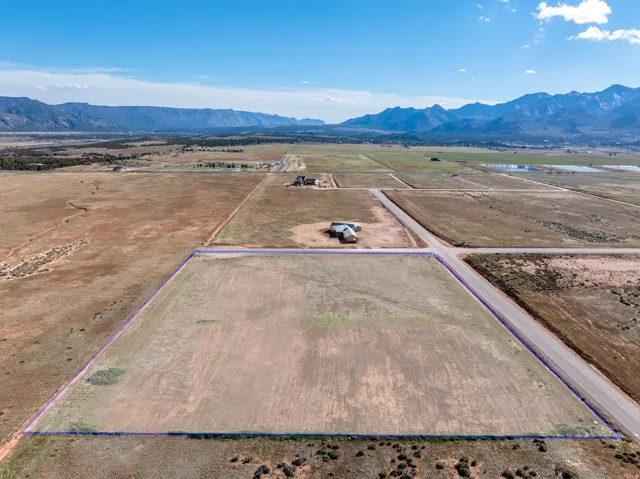 Aerial view of sparsely populated area with mountains and property boundaries highlighted