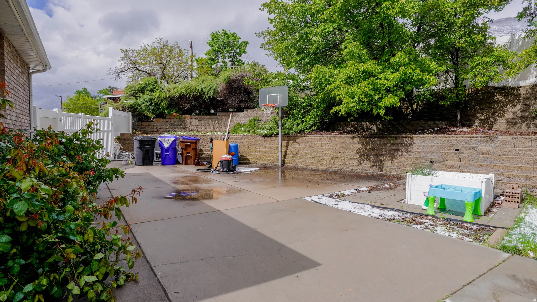 Fenced backyard with a patio area