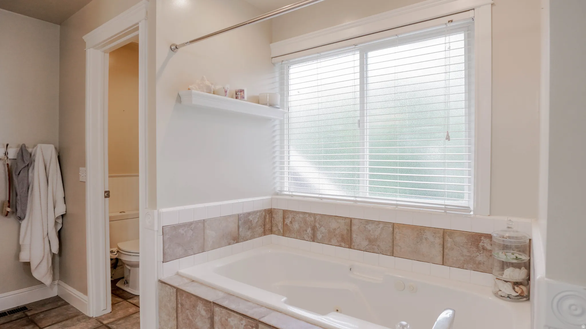 Full bathroom featuring a bath, double vanity, and Separate Shower