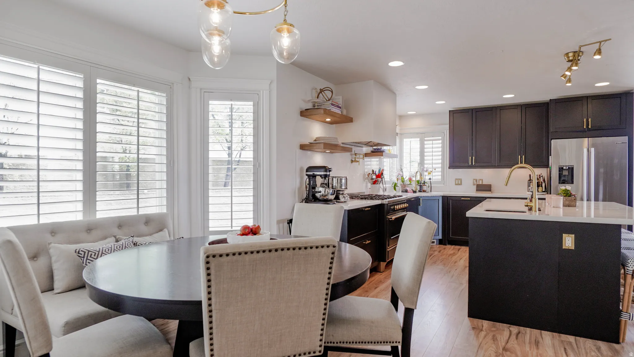 Dining space with light wood-style flooring and recessed lighting