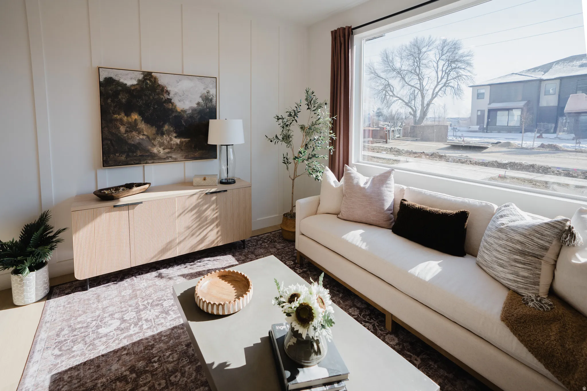 Living area featuring a decorative wall