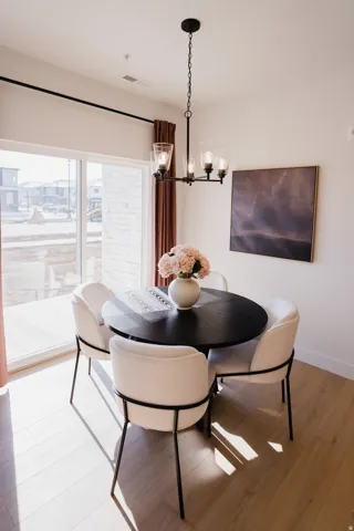 Dining space featuring a chandelier and light wood-style floors