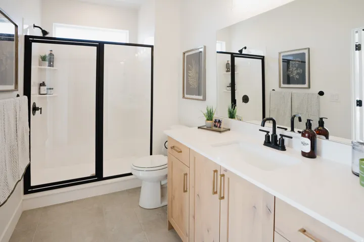 Bathroom with vanity and a shower stall