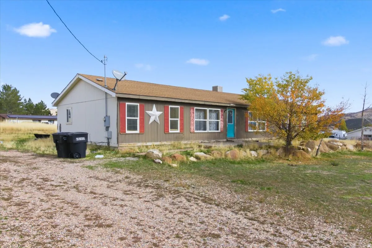 Ranch-style house featuring a chimney