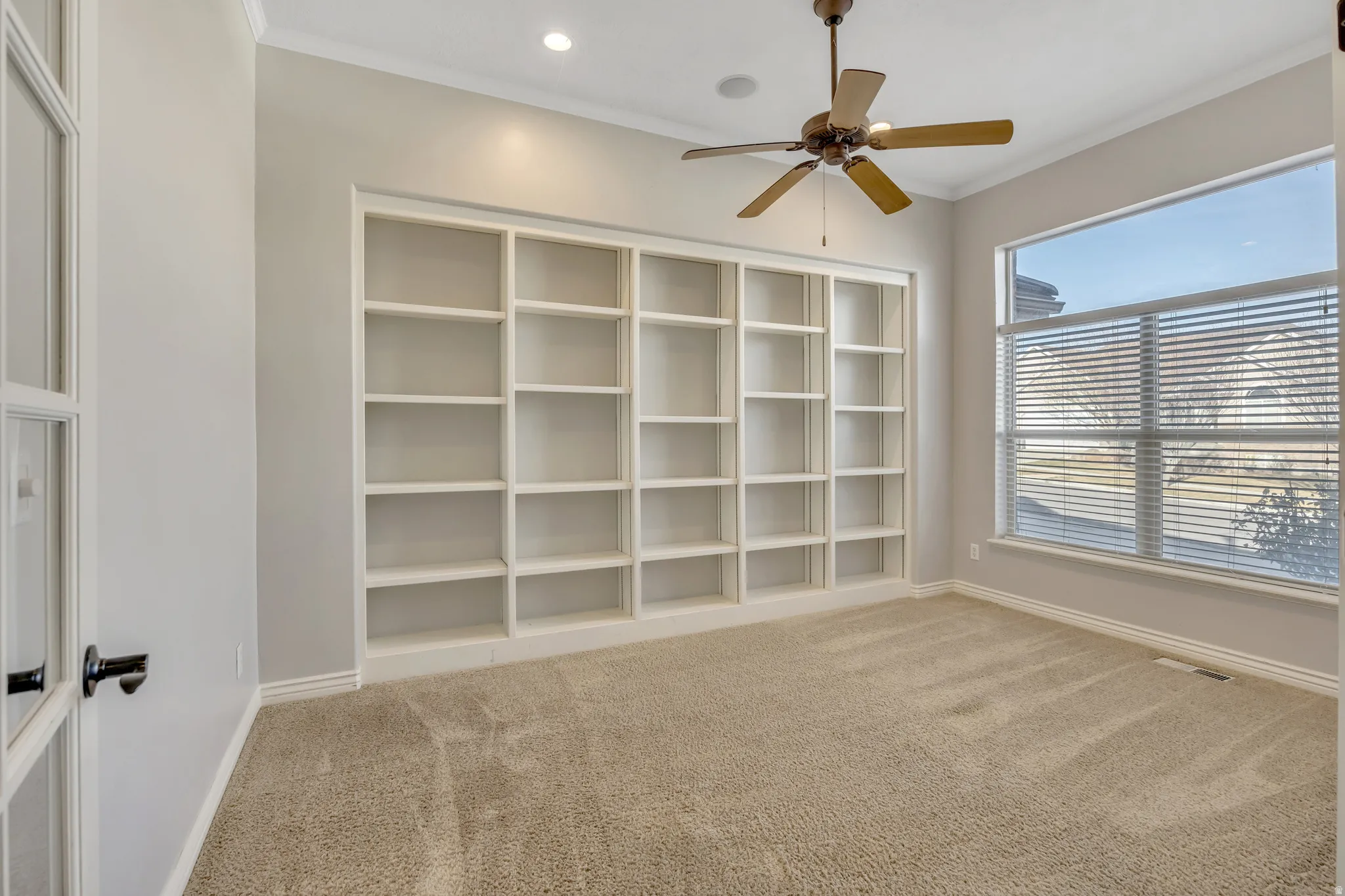 Unfurnished room featuring ornamental molding, a ceiling fan, light carpet, and recessed lighting