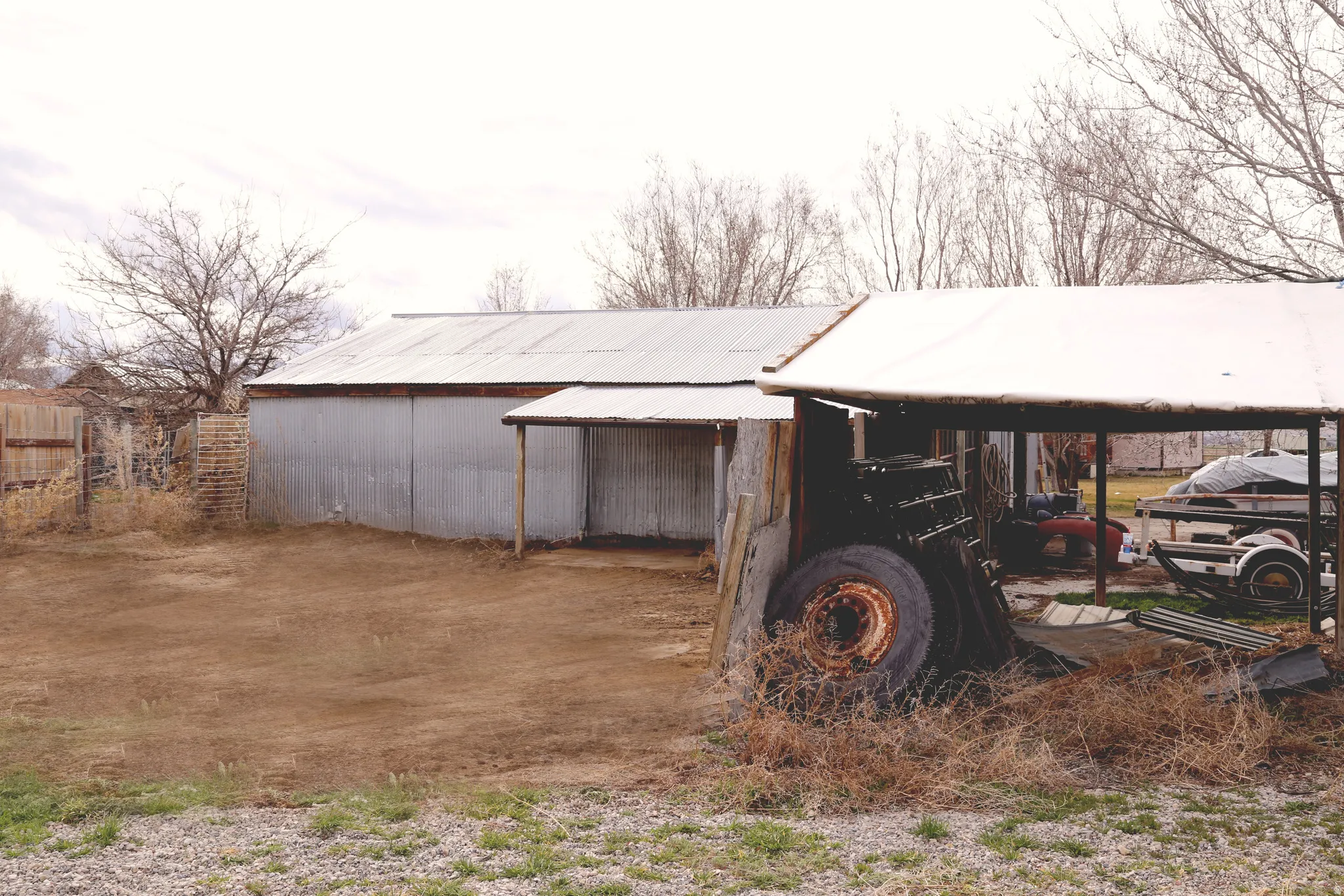 View of pole building with a detached carport
