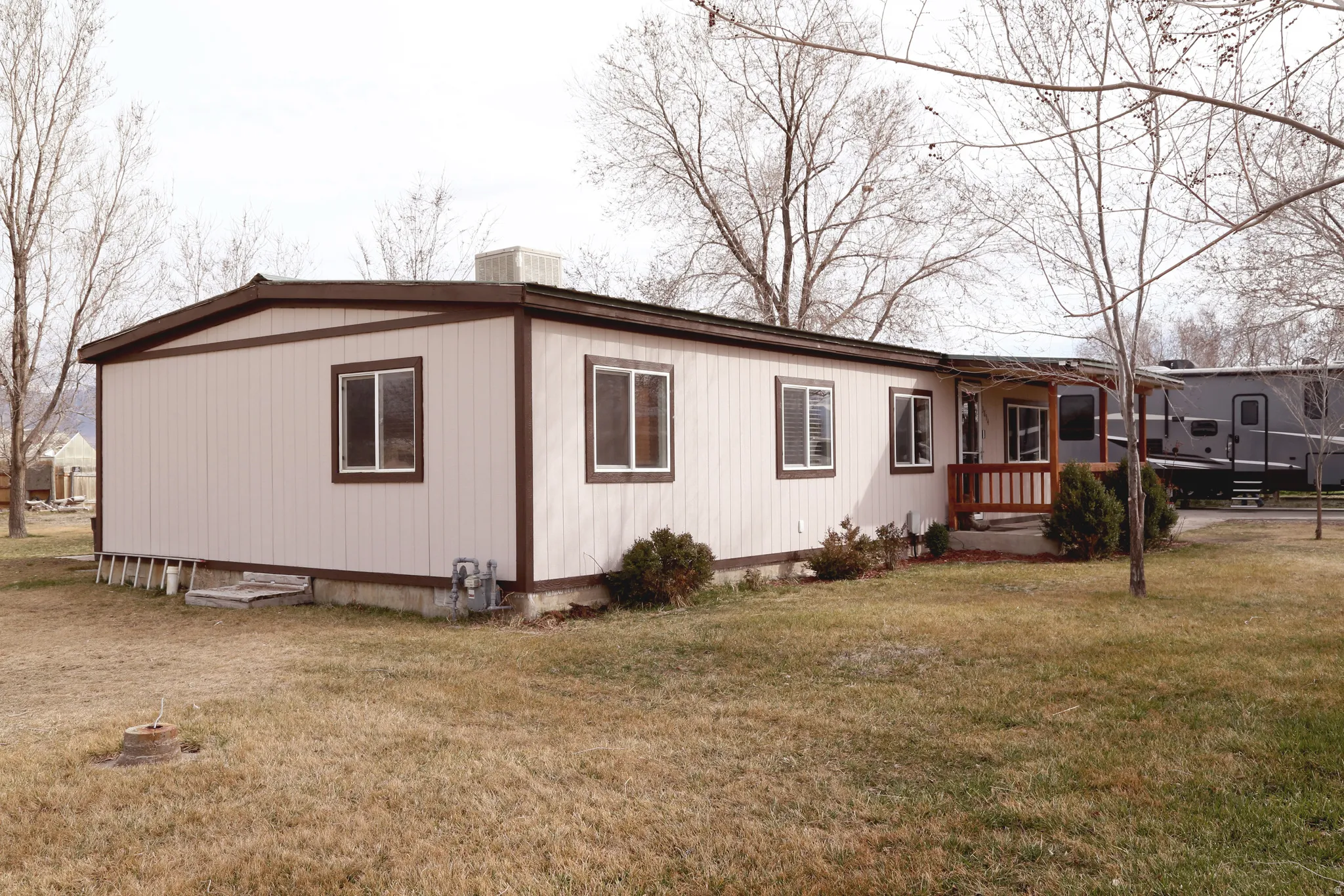 View of property exterior featuring a yard