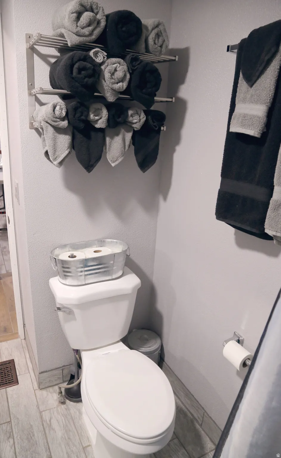 Bathroom with toilet and baseboards