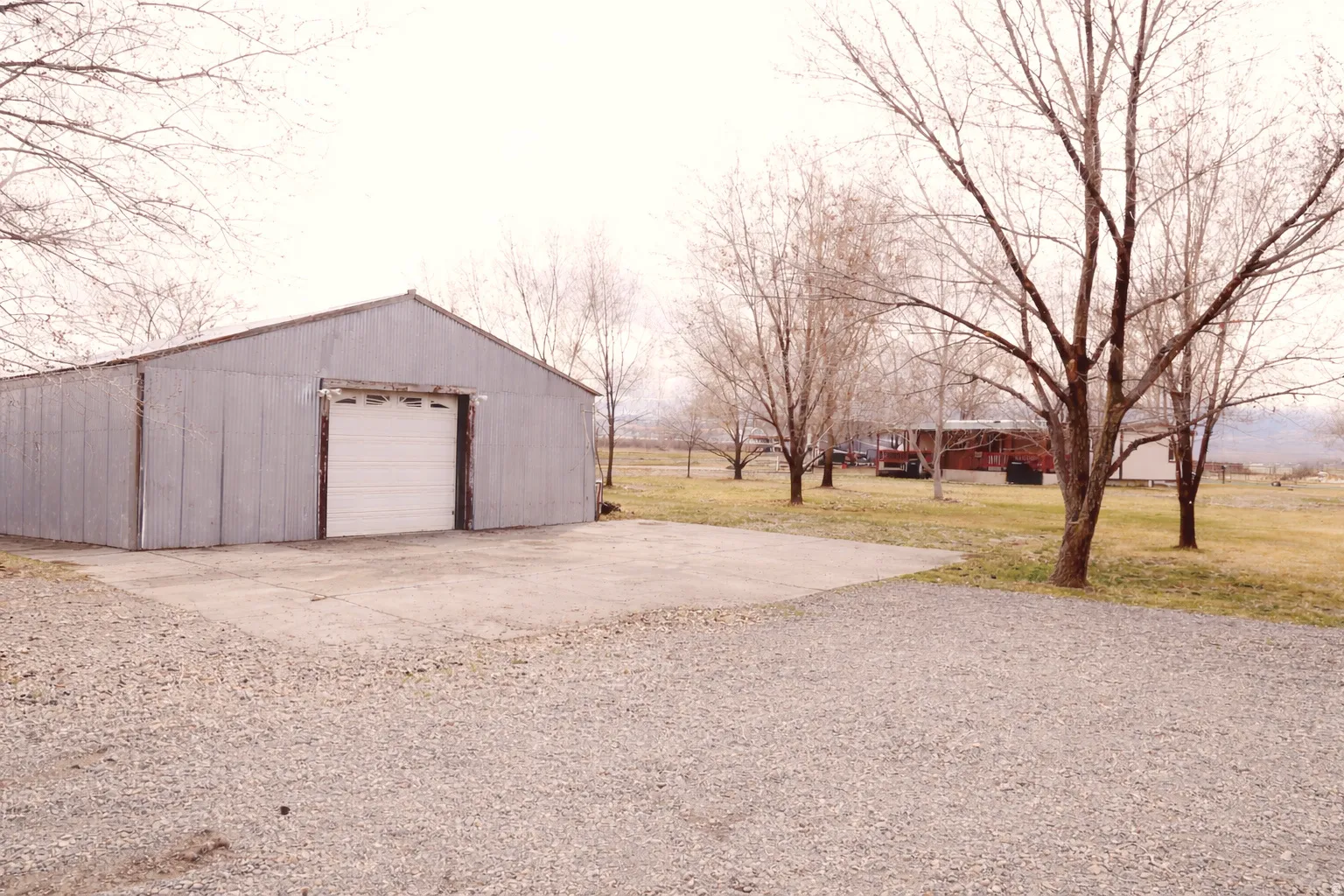 Detached garage with concrete driveway