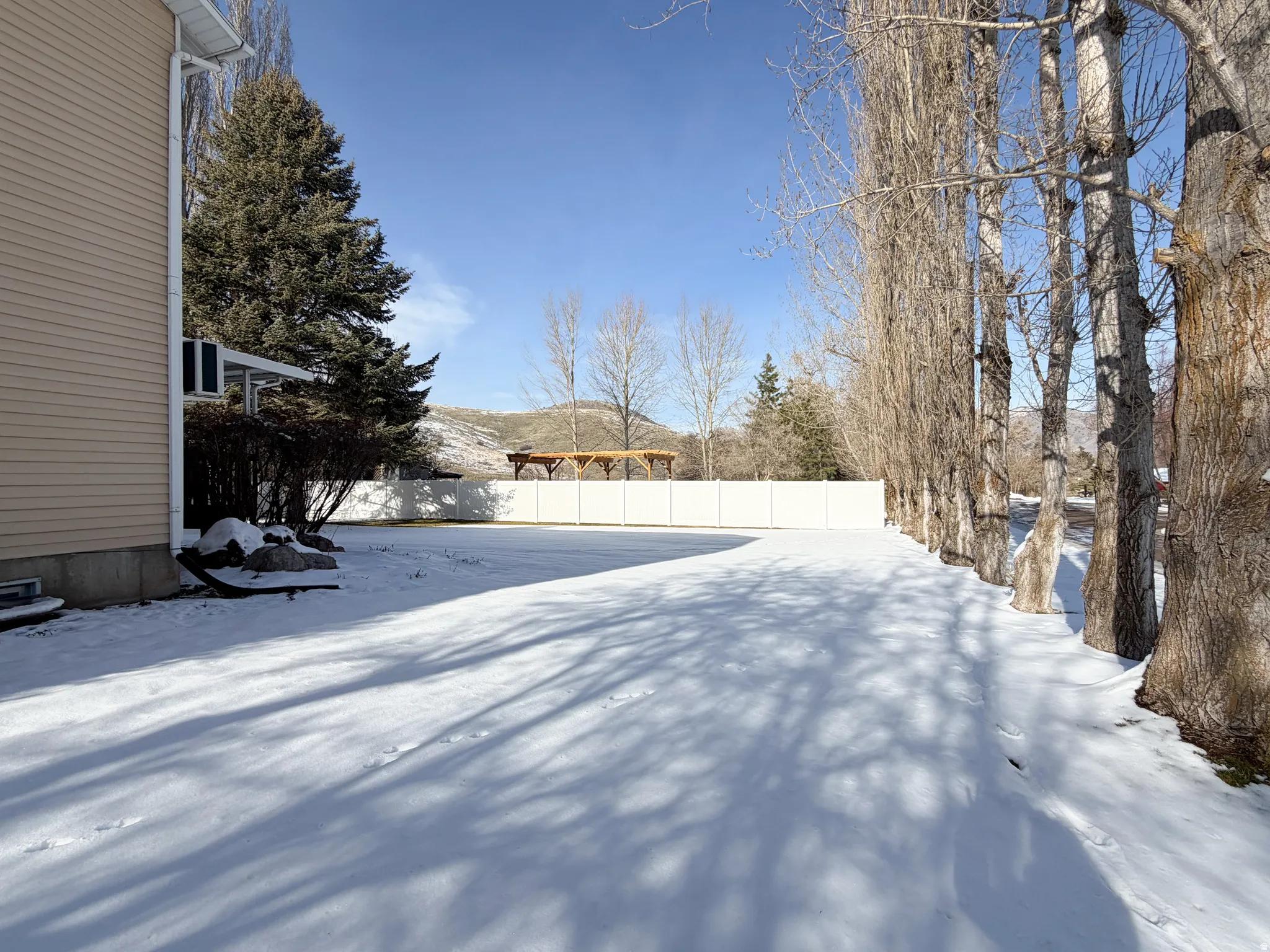 View of yard covered in snow