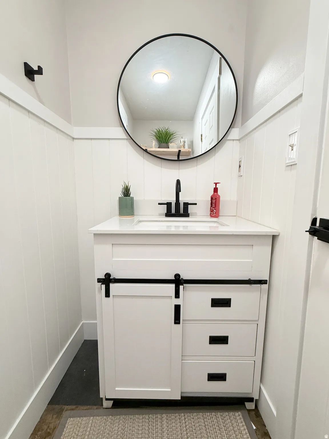 Bathroom with vanity and concrete flooring