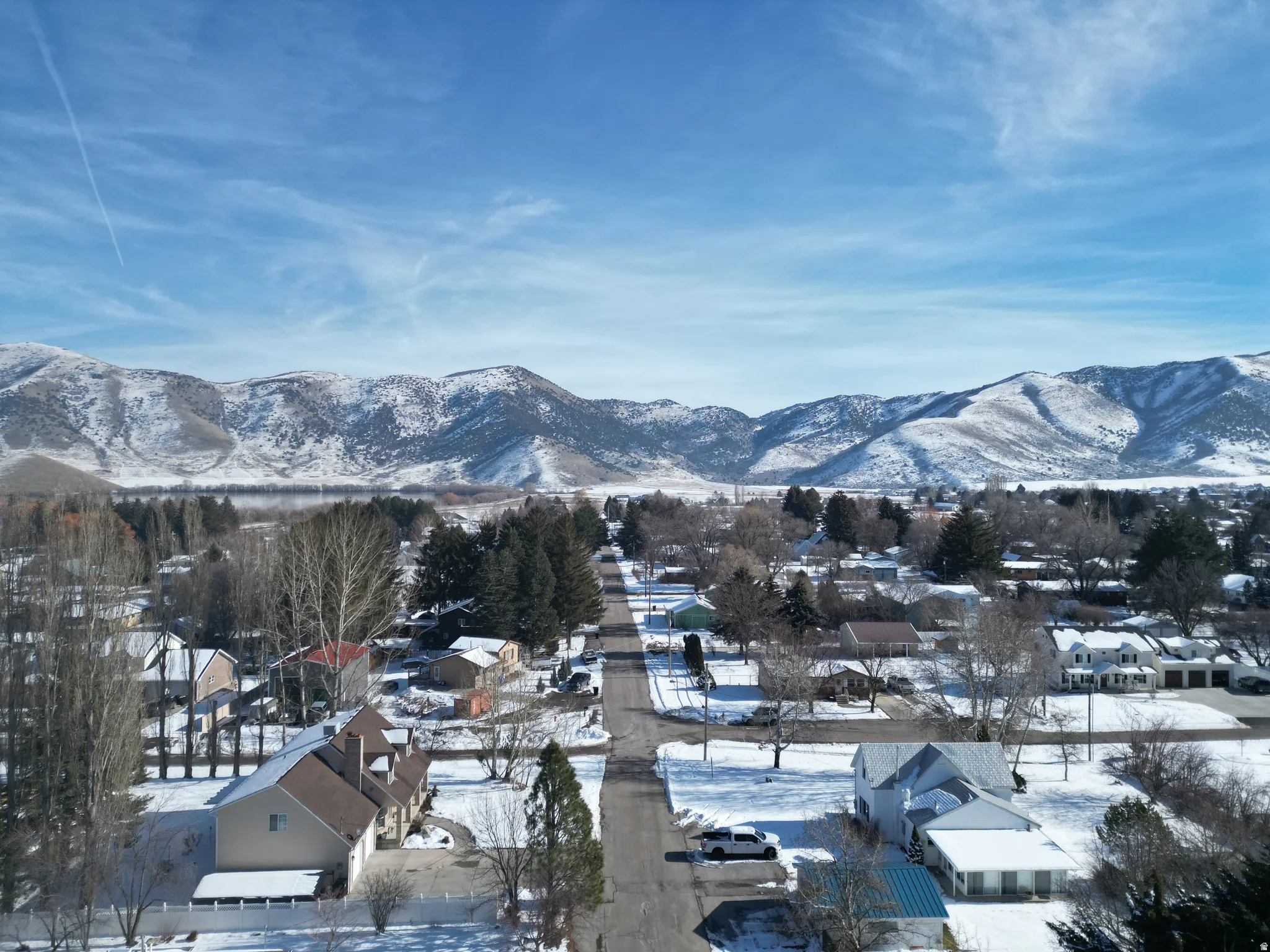 View of mountain backdrop featuring nearby suburban area