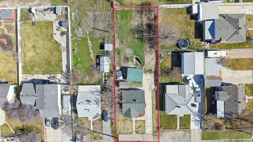 Aerial perspective of suburban area with property parcel outlined