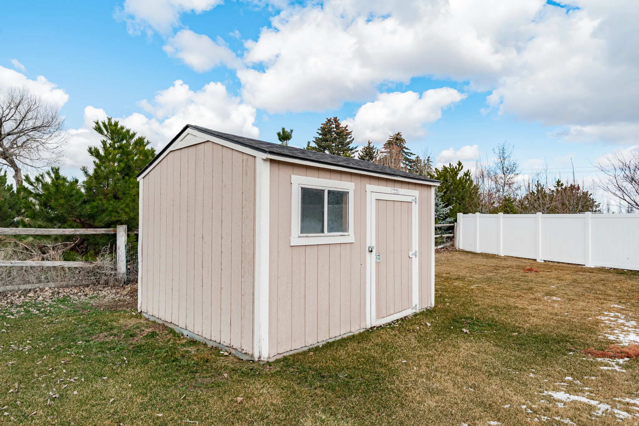 View of shed featuring a fenced backyard