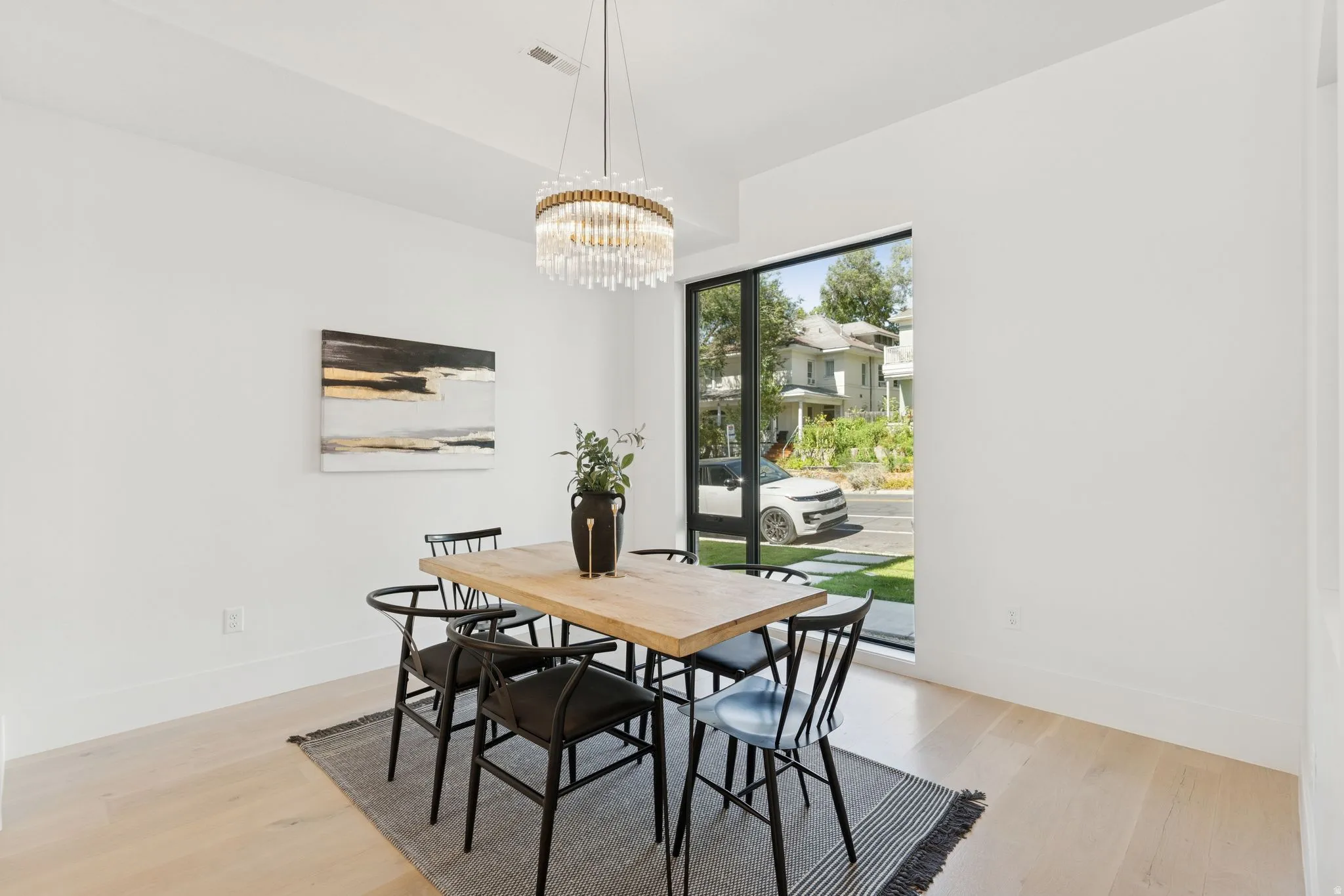 Dining room featuring light wood-style floors and a chandelier