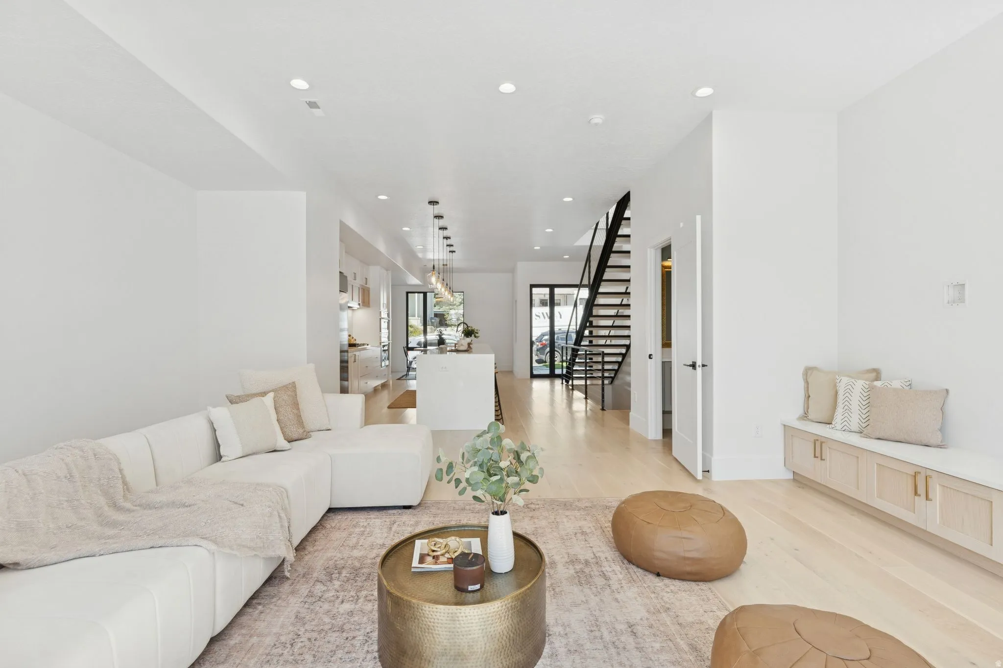 Living room featuring light wood finished floors and recessed lighting