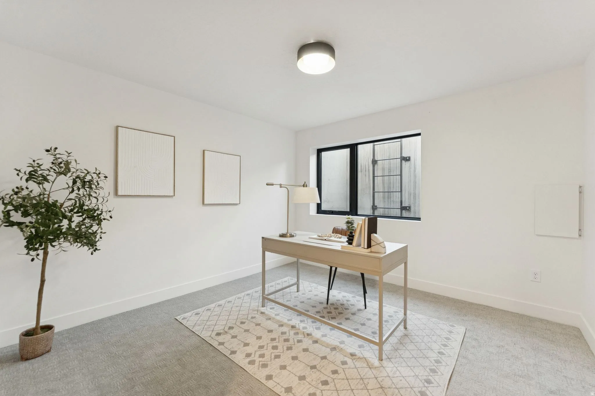 Office space featuring light colored carpet